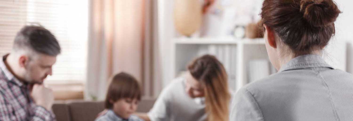 disabled child with parents and psychologist